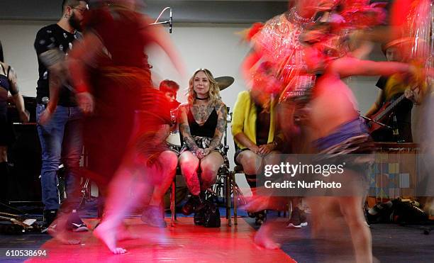 Megan Massacre, renowned American tattoo artist, dancing with a group of Ecuadorian dance at the tattoo convention &quot;Mitad del Mundo&quot; in...