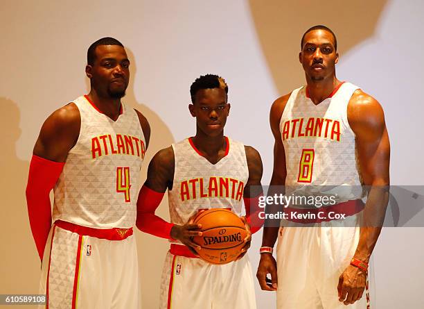 Paul Millsap, Dennis Schroder and Dwight Howard of the Atlanta Hawks pose during media day on September 26, 2016 in Atlanta, Georgia.