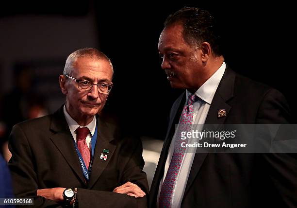 Democratic presidential nominee Hillary Clinton's Campaign Chairman John Podesta talks with with Rev. Jesse Jackson prior to the start of the...