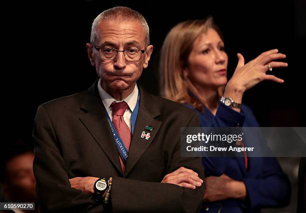 Democratic presidential nominee Hillary Clinton's Campaign Chairman John Podesta looks on prior to the start of the Presidential Debate at Hofstra...