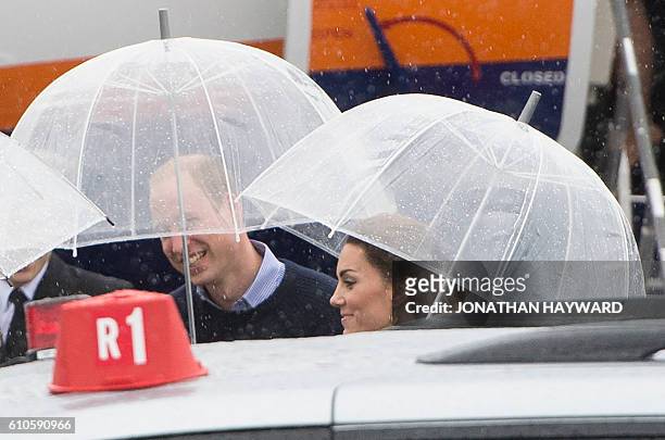 Prince William and Catherine, the Duke and Duchess of Cambridge arrive in Bella Bella, British Columbia on September 26, 2016. / AFP / POOL /...