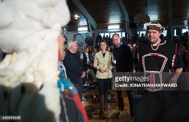 Prince William and Catherine, the Duke and Duchess of Cambridge greet native elders in Bella Bella, British Columbia on September 26, 2016. / AFP /...