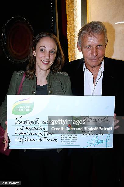 Awarded Danuta Pieter for the "Hopitaux de Paris" Foundation and Master of Ceremony Patrick Poivre d'Arvor attend the 'Trophees du Bien Etre' by...