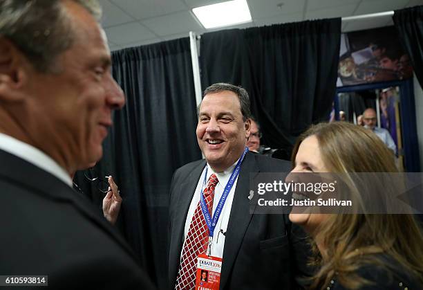 New York Gov. Andrew Cuomo talks with New Jersey Gov. Chris Christie and his wife Mary Pat Christie during the Presidential Debate at Hofstra...