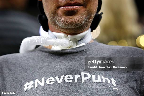 Fomer New Orleans Saints Steve Gleason, who suffers from ALS, wheres a shirt with the hastag #NeverPunt before a game between the New Orleans Saints...