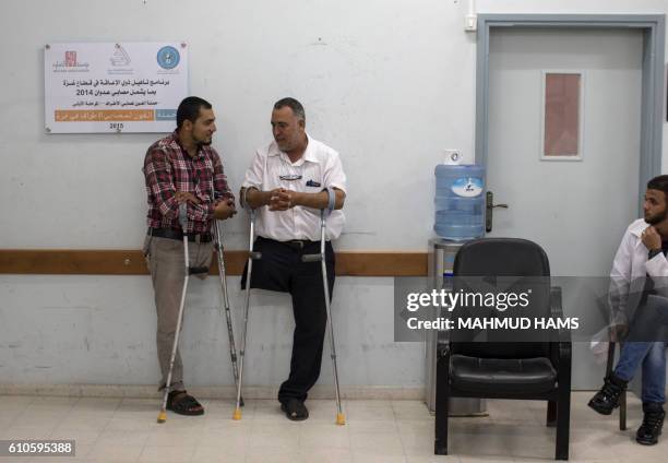 Imad al-Firi , a 50-year-old Palestinian man who was wounded during the 50-day war between Israel and Hamas militants in the summer of 2014, stands...