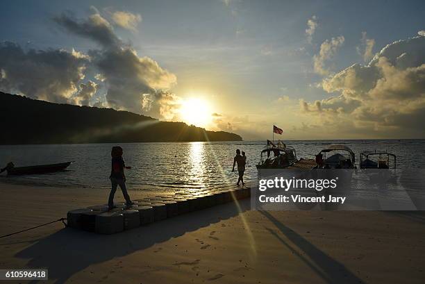 perhentian child going to boat school kecil, malaysia - pontoon boat stock pictures, royalty-free photos & images