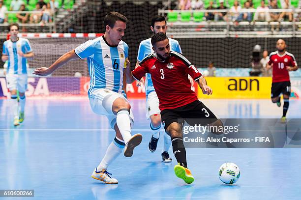 Fernando Wilhelm of Argentina and Abdelrahman Elashwal of Egypt compete for the ball during the FIFA Futsal World Cup Quarter-Final match between...