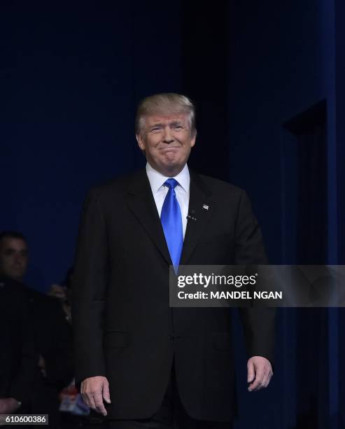 Republican presidential nominee Donald Trump arrives on stage for the first presidential debate at Hofstra University in Hempstead, New York on...