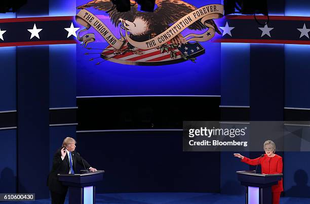 Donald Trump, 2016 Republican presidential nominee, and Hillary Clinton, 2016 Democratic presidential nominee, speak during the first U.S....