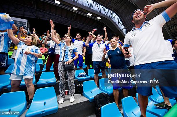 Supporters of Argentina celebrate after the FIFA Futsal World Cup Quarter-Final match between Argentina and Egypt at Coliseo Ivan de Bedout stadium...