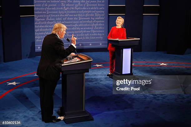Republican presidential nominee Donald Trump speaks as Democratic presidential nominee Hillary Clinton listens during the Presidential Debate at...