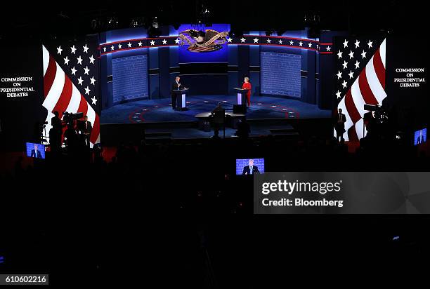 Donald Trump, 2016 Republican presidential nominee, speaks as Hillary Clinton, 2016 Democratic presidential nominee, listens during the first U.S....