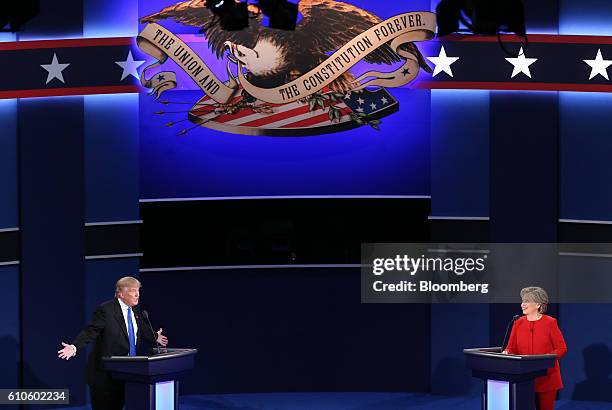 Donald Trump, 2016 Republican presidential nominee, speaks as Hillary Clinton, 2016 Democratic presidential nominee, listens during the first U.S....