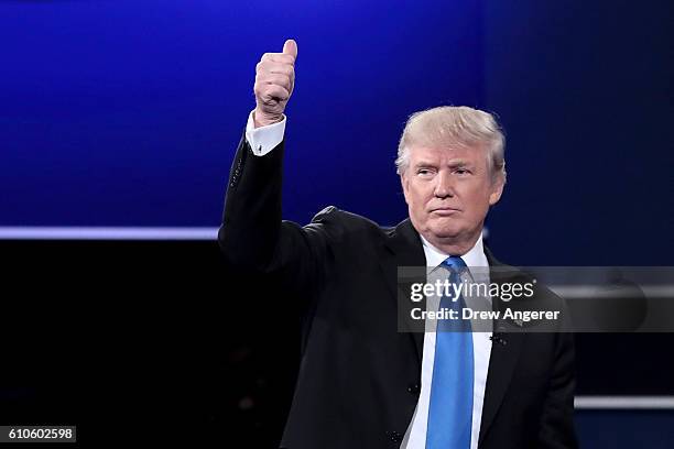Republican presidential nominee Donald Trump waves after the Presidential Debate with Democratic presidential nominee Hillary Clinton at Hofstra...