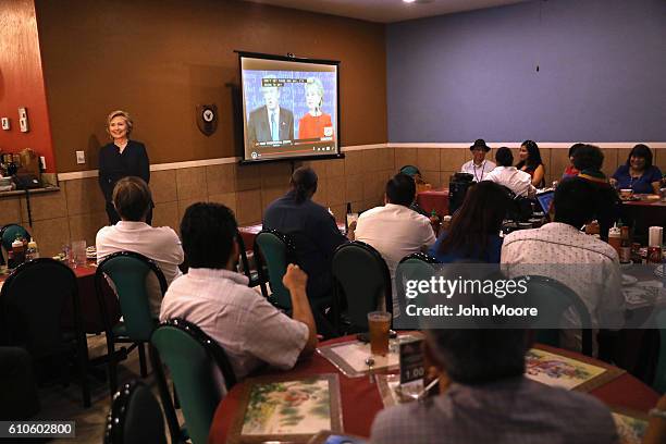 Cardboard cutout of Democratic presidential candidate Hillary Clinton is on display at a debate-watching party for supporters of Hillary Clinton at...