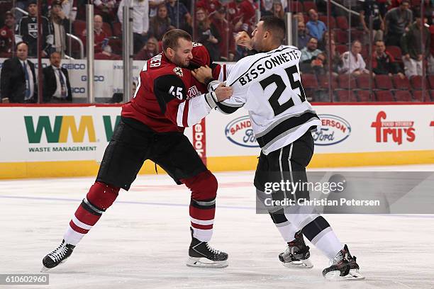 Stefan Fournier of the Arizona Coyotes fights with Paul Bissonnette of the Los Angeles Kings during the first period of the preseason NHL game at...