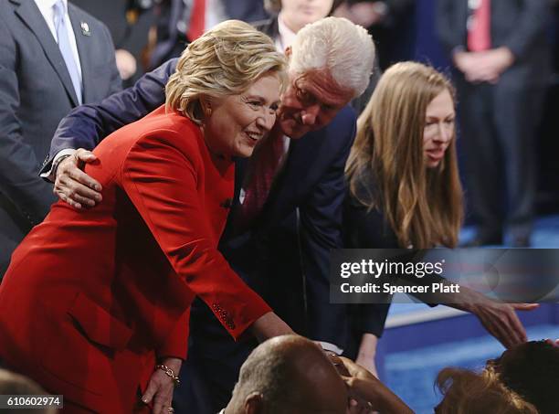Democratic presidential nominee Hillary Clinton looks on with husband and former U.S. President Bill Clinton and daughter, Chelsea Clinton after the...