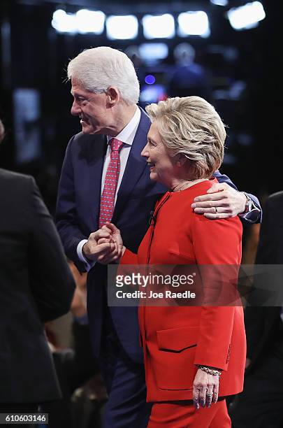 Democratic presidential nominee Hillary Clinton hugs husband and former U.S. President Bill Clinton after the Presidential Debate with Republican...