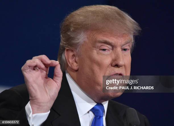 Republican nominee Donald Trump gestures during the first presidential debate at Hofstra University in Hempstead, New York on September 26, 2016.