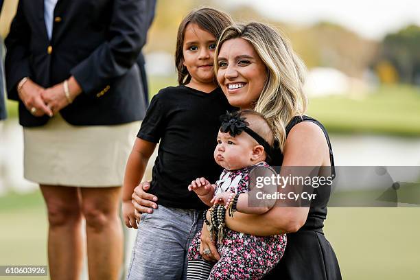 Ellie Day, wife of Jason Day of Australia, and their kids Lucy and Dash attend a trophy ceremony following Day's one stroke victory on the 18th hole...