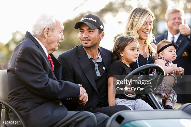 Arnold Palmer, Jason Day of Australia, Dash Day, Ellie Day and Lucy Day sit for a photo following Day's one stroke victory on the 18th hole green...