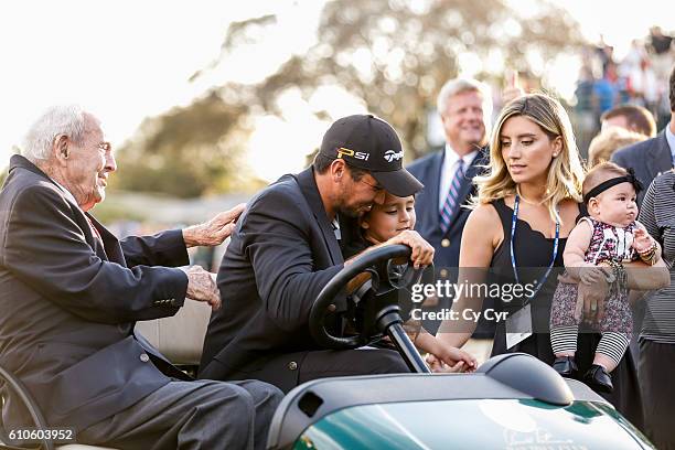 Arnold Palmer, Jason Day of Australia, Dash Day, Ellie Day and Lucy Day laugh during a photo call following Day's one stroke victory on the 18th hole...