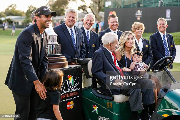 Jason Day of Australia, Dash Day, Arnold Palmer, Ellie Day and Lucy Day share a laugh during a trophy photo call following Day's one stroke victory...