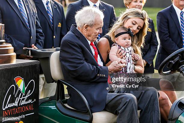 Arnold Palmer, Ellie Day and Lucy Day share a laugh following Jason Day's one stroke victory on the 18th hole green in the final round of the Arnold...