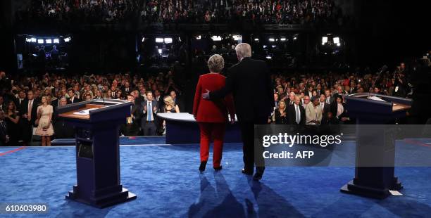 Democratic nominee Hillary Clinton and Republican nominee Donald Trump greet the audience at the end of the first presidential debate at Hofstra...