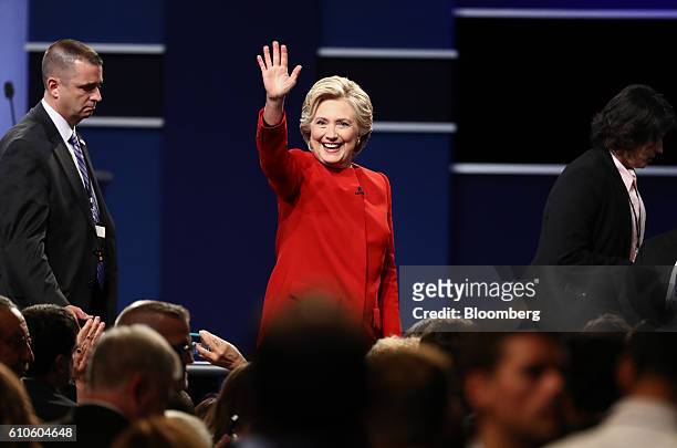 Hillary Clinton, 2016 Democratic presidential nominee, waves to attendees after the first U.S. Presidential debate at Hofstra University in...