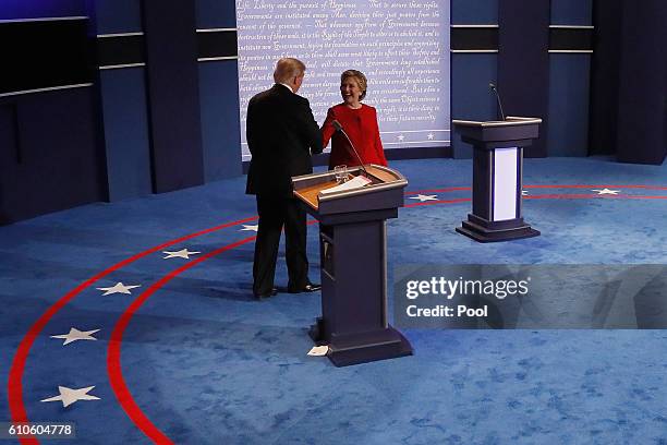 Republican presidential nominee Donald Trump and Democratic presidential nominee Hillary Clinton shake hands after the Presidential Debate at Hofstra...