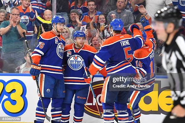 Ben Betker, Kris Versteeg, Tyler Pitlick and Mark Fayne of the Edmonton Oilers celebrate a goal during the preseason game against the Calgary Flames...