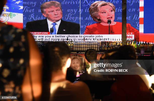 Clinton supporters watch the first US presidential debate between Democratic candidate Hillary Clinton and Republican Donald Trump, at a debate watch...