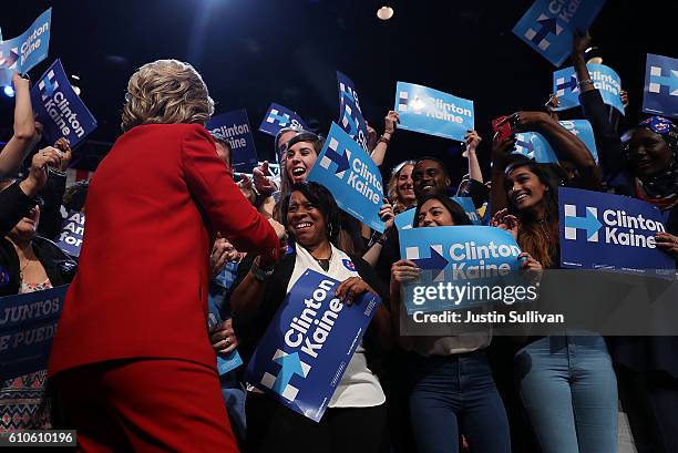 Democratic presidential nominee Hillary Clinton greets supporters during a debate-watch party at The Space at Westbury on September 26, 2016 in...