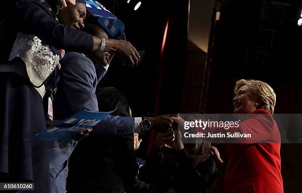 Democratic presidential nominee Hillary Clinton greets supporters during a debate-watch party at The Space at Westbury on September 26, 2016 in...