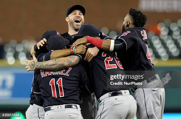 Cleveland Indians players celebrate the 7-4 win to clinch the Central Division of a baseball game against the Detroit Tigers in Detroit, Michigan...