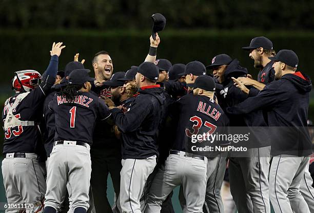 Cleveland Indians players celebrate the 7-4 win to clinch the Central Division of a baseball game against the Detroit Tigers in Detroit, Michigan...