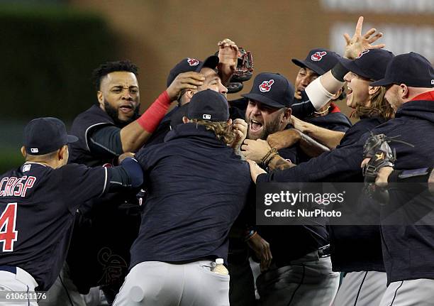 Cleveland Indians players celebrate the 7-4 win to clinch the Central Division of a baseball game against the Detroit Tigers in Detroit, Michigan...