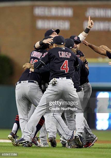 Cleveland Indians players celebrate the 7-4 win to clinch the Central Division of a baseball game against the Detroit Tigers in Detroit, Michigan...