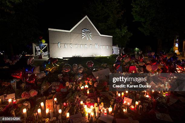 Candles are lit in front of the Cascade Mall on September 26, 2016 in Burlington, Washington. Arcan Cetin a resident of Oak Harbor, Washington is...