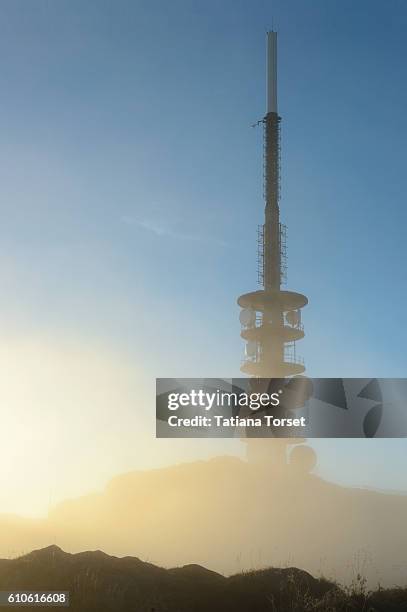antenna on ulriken mountain in the fog - ulriken bergen stock pictures, royalty-free photos & images