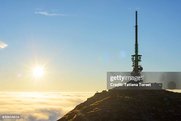 antenna on ulriken mountain in the fog - ulriken bergen stock pictures, royalty-free photos & images