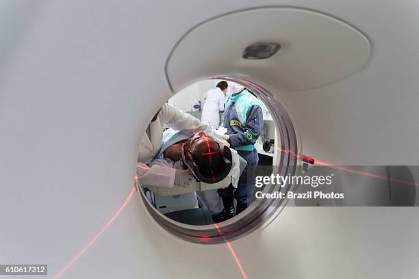 Patient in medical MRI scanner, magnetic resonance imaging, a medical imaging technique used in radiology to image the anatomy and the physiological...