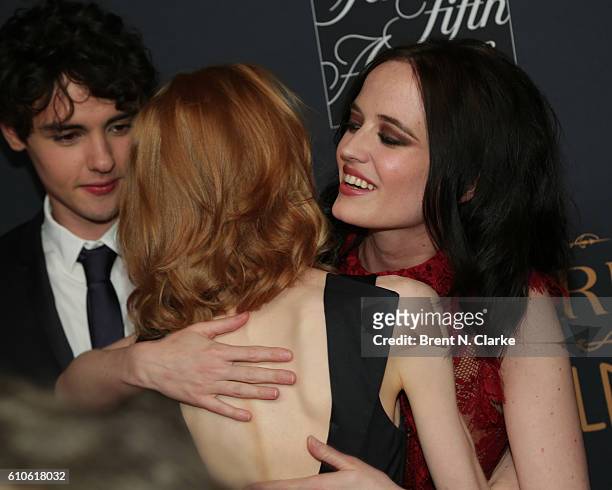 Actress Lauren McCrostie is greeted by actress Eva Green as actor Finlay MacMillan looks on during the "Miss Peregrine's Home for Peculiar Children"...