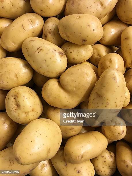 full frame shot of organic raw potatoes in market - potatoes stock pictures, royalty-free photos & images