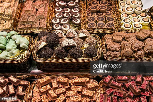 high angle view of various chocolates for sale at market stall - close up of chocolates for sale fotografías e imágenes de stock