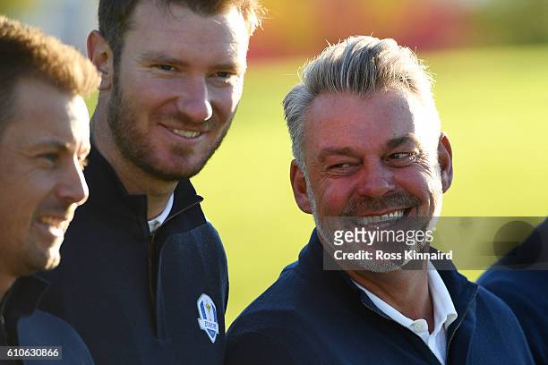 Captain Darren Clarke of Europe looks on with his team during team photocalls prior to the 2016 Ryder Cup at Hazeltine National Golf Club on...