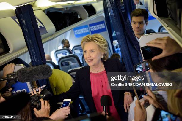 Democratic presidential nominee Hillary Clinton speaks to press on her plane at Westchester County Airport September 27, 2016 in White Plains, New...