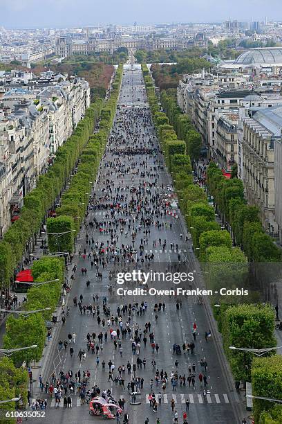 An elevated view as tourists and Parisians enjoy the Champs Elysées during the 2016 car-free day organised in Paris across 45% of the area of the...